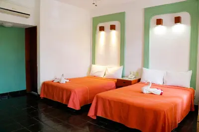 Cama o camas de una habitación en Hotel Careyes Puerto Escondido