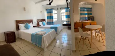 Cama o camas de una habitación en Hotel Careyes Puerto Escondido