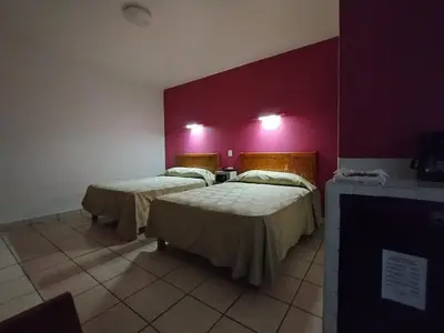 Cama o camas de una habitación en Los Ciruelos Oaxaca