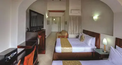 Cama o camas de una habitación en Best Western Taxco