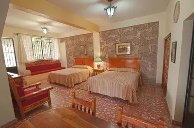 Cama o camas de una habitación en Hotel Posada San Javier