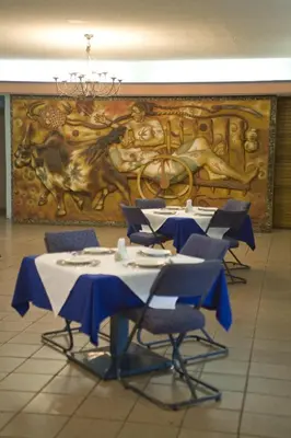 Un restaurante o sitio para comer en Hotel Calli