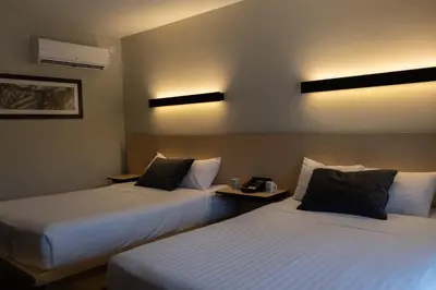 Cama o camas de una habitación en BV Hotel Atlixco