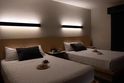 Cama o camas de una habitación en BV Hotel Atlixco