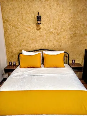 Cama o camas de una habitación en Casa de las flores Hotel Boutique