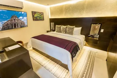 Cama o camas de una habitación en Casa Naila Hotel Boutique
