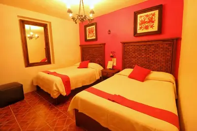 Cama o camas de una habitación en La Escondida Hotel Boutique