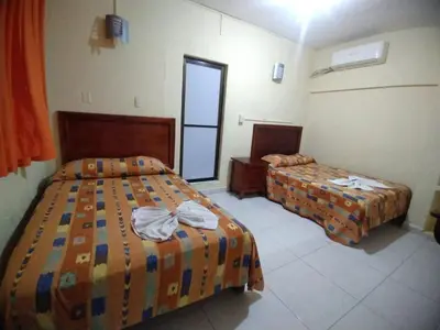 Cama o camas de una habitación en Hotel Puerto Real-Minatitlán