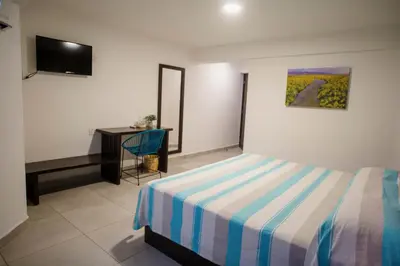 Cama o camas de una habitación en Hotel Camino Del Sol