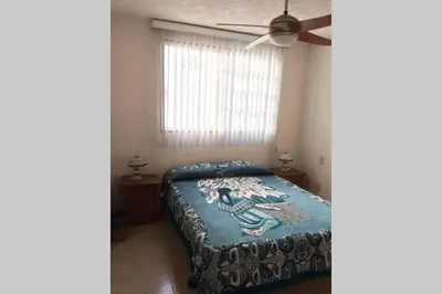 Cama o camas de una habitación en Depa Frente al Mar en Acapulco Diamante