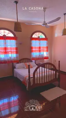 Cama o camas de una habitación en La Casona Hostel