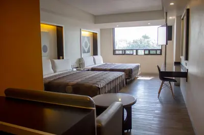 Cama o camas de una habitación en Hotel Harare
