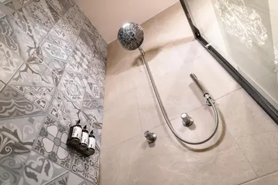 Un baño de voco Royalty Puebla Downtown by IHG