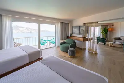 Cama o camas de una habitación en Hotel Amares Acapulco
