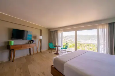 Una televisión o centro de entretenimiento en Hotel Amares Acapulco