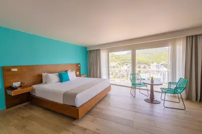 Cama o camas de una habitación en Hotel Amares Acapulco