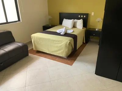 Cama o camas de una habitación en Hotel Escala Puebla Centro