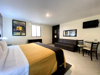 Cama o camas de una habitación en Hotel Escala Puebla Centro