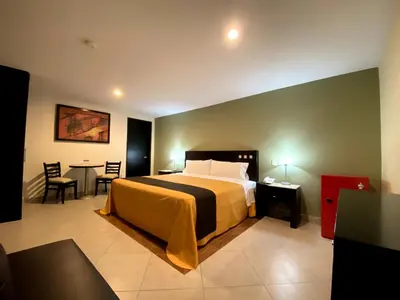 Cama o camas de una habitación en Hotel Escala Puebla Centro