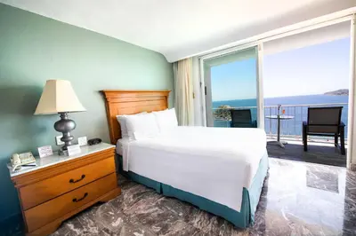 Cama o camas de una habitación en Emporio Acapulco