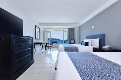 Cama o camas de una habitación en Krystal Beach Acapulco