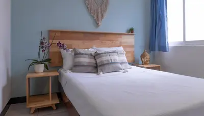 Cama o camas de una habitación en Esencia Hostal Terminal Oaxaca