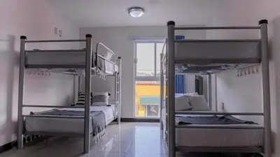 Cama o camas de una habitación en Esencia Hostal Terminal Oaxaca