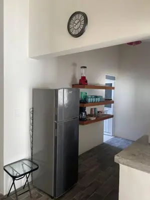 Una cocina o zona de cocina en Casa de verano totalmente equipada y amueblada