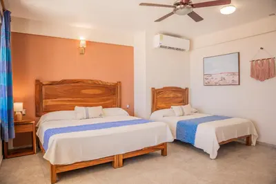 Cama o camas de una habitación en Hotel El Mirador
