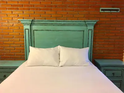 Cama o camas de una habitación en Hacienda Soltepec Suites Campo de Golf