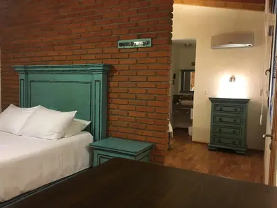 Cama o camas de una habitación en Hacienda Soltepec Suites Campo de Golf