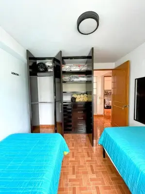 Cama o camas de una habitación en DEPTO FRENTE A ESTADIO GNP ANTES FORO SOL y AUTODROMO F1 A 10 MIN CAMINANDO