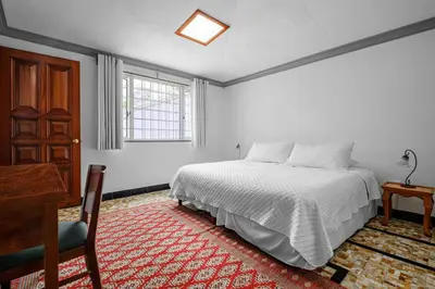 Cama o camas de una habitación en Senda Stays Coyoacan - 6BR Casa and Garden Steps from Frida Kahlo