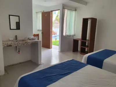 Cama o camas de una habitación en Riviera Bonfil