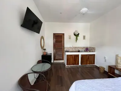 Una televisión o centro de entretenimiento en Casa Marko