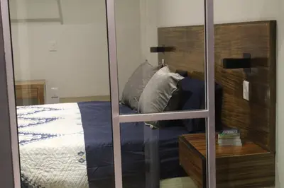 Cama o camas de una habitación en BERTHEL SUITES