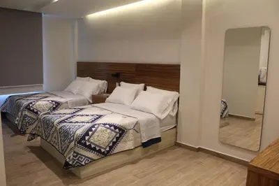 Cama o camas de una habitación en BERTHEL SUITES