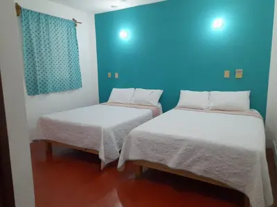 Cama o camas de una habitación en Hotel Doña Mary Huatulco