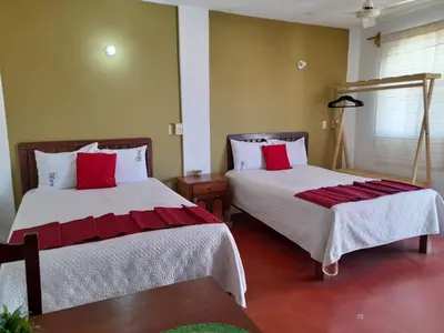 Cama o camas de una habitación en Hotel Doña Mary Huatulco