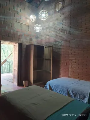 Cama o camas de una habitación en Hotel Bendita Luna