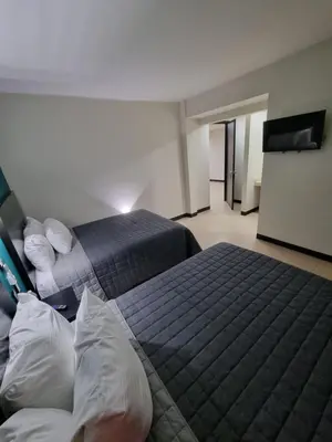 Cama o camas de una habitación en EMS Hoteles Centro Histórico
