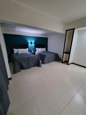Cama o camas de una habitación en EMS Hoteles Centro Histórico
