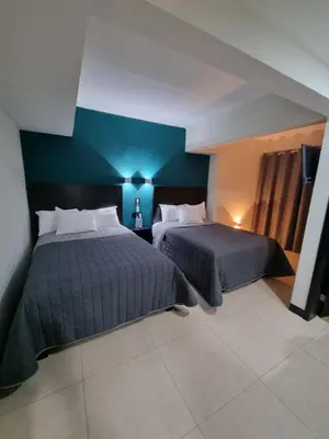 Cama o camas de una habitación en EMS Hoteles Centro Histórico