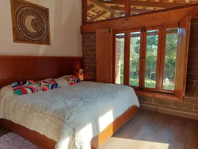 Cama o camas de una habitación en cabaña el rio la grande