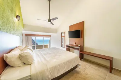 Cama o camas de una habitación en Villas Coral Huatulco