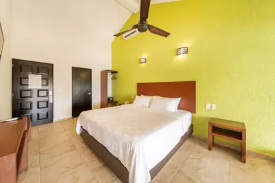 Cama o camas de una habitación en Villas Coral Huatulco