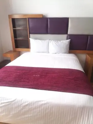 Cama o camas de una habitación en Hotel Alhaja Puebla Centro Histórico