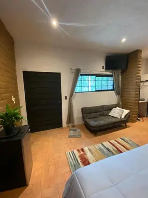 Cama o camas de una habitación en SUITE EL GUAYABO en Tepoztlán