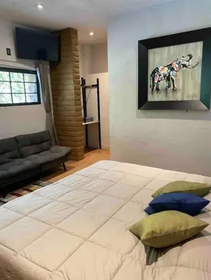 Cama o camas de una habitación en SUITE EL GUAYABO en Tepoztlán