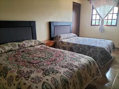 Cama o camas de una habitación en VILLAZOL CABAÑAS